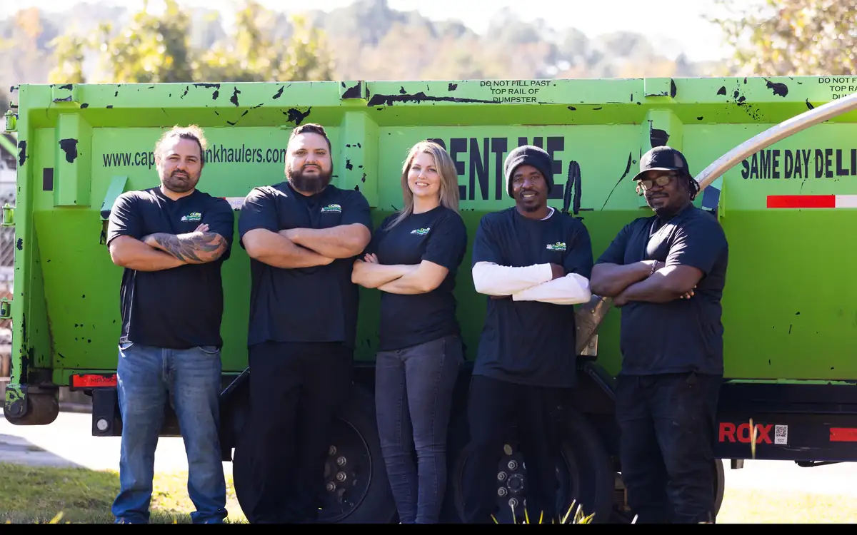 The Capital City Junk Haulers team in company shirts